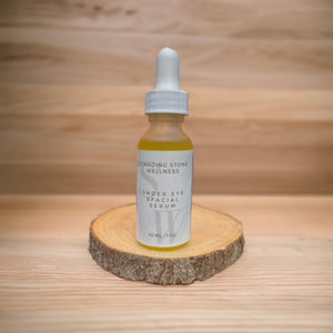 Under Eye and Facial Serum on wooden platform, sitting on wooden table with wood background. 
